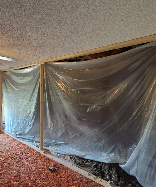 A room with a large sheet of plastic covering the walls