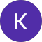 A purple circle with a white k on it